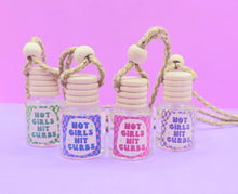 Load image into Gallery viewer, Girly pink Car diffuser, Hot girls hit curbs car diffuser glass bottle with wooden lid. cute car accessories for women. Refillable car diffuser